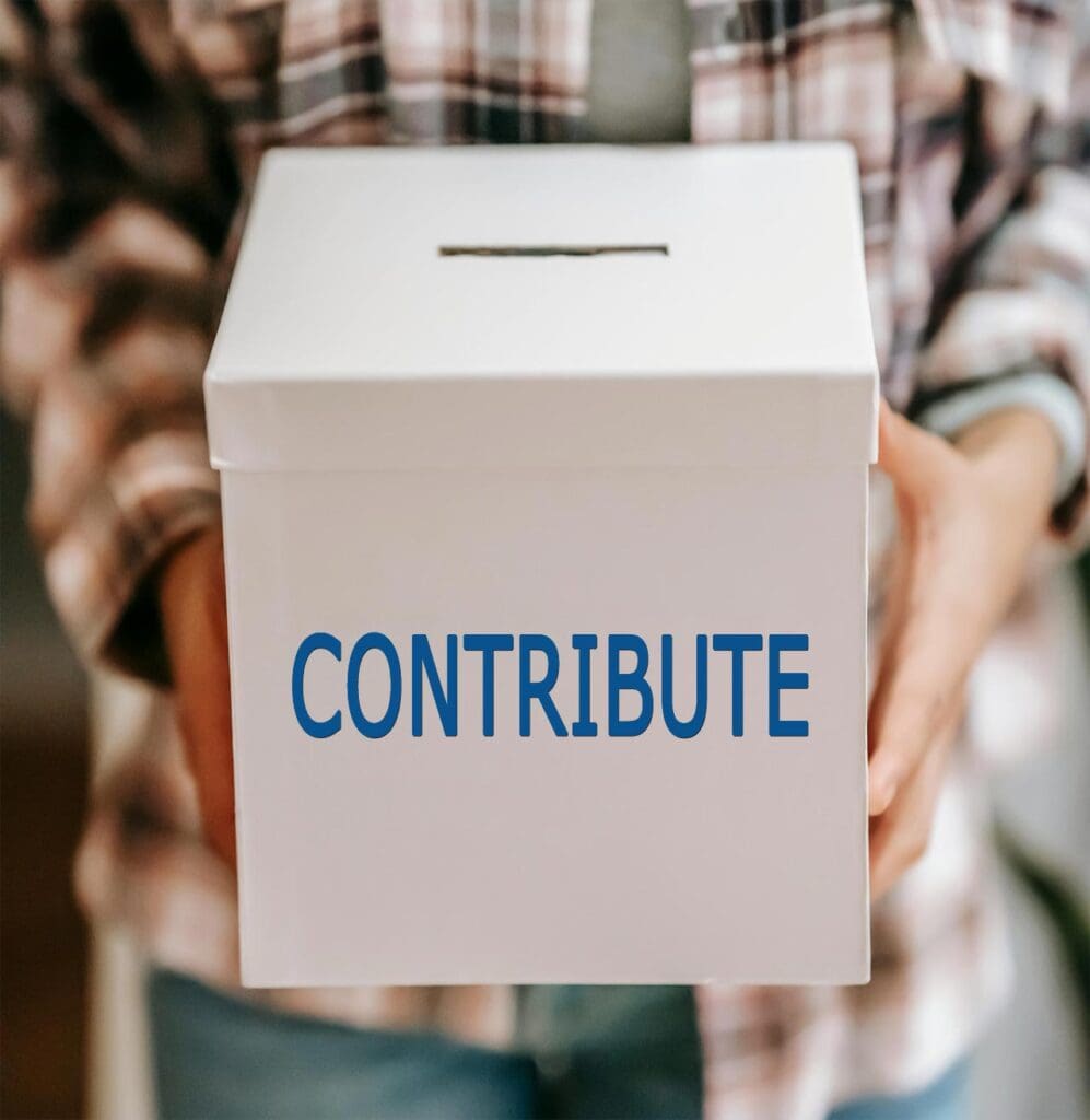 Cropped photo of an anonymous person holding a white box with the word 'Donate' on it in blue letters.